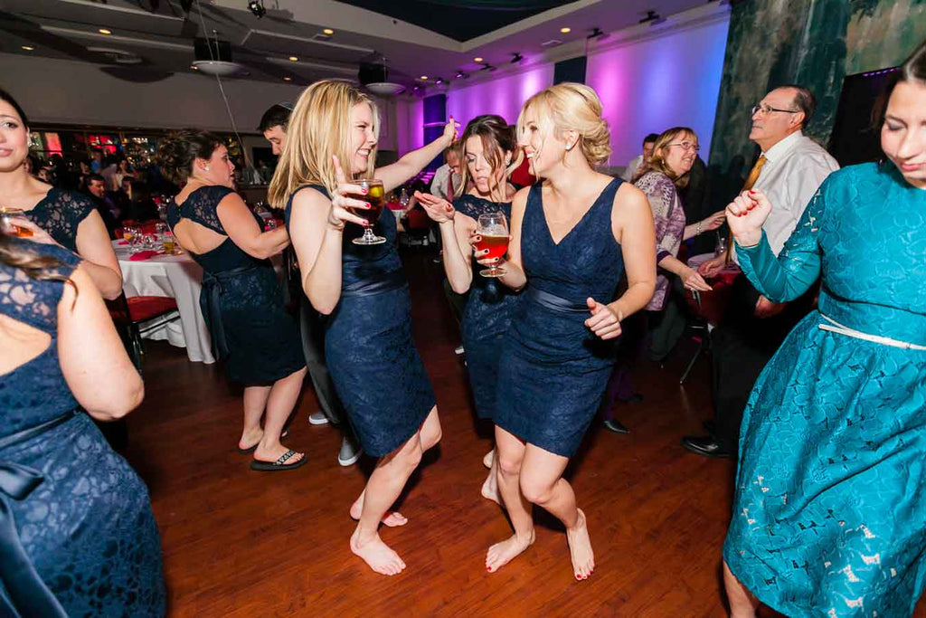 The bridesmaids on the dancefloor | A Blue and Pink Rock 'n Roll Wedding