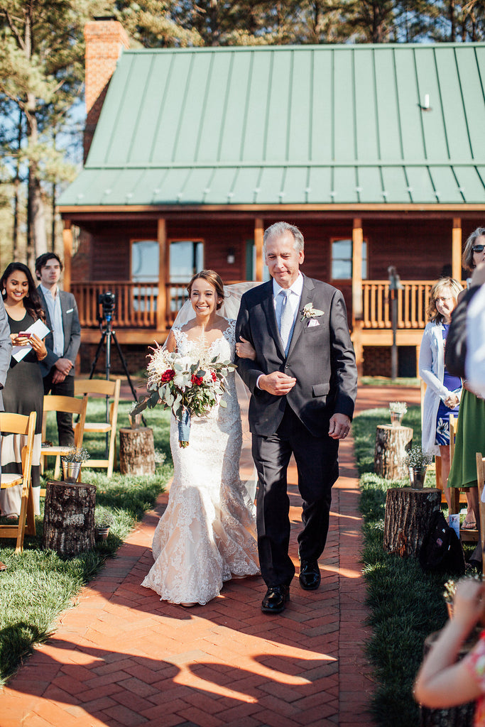 Bride-walking-down-aisle-Emily-Caleb-Featured-BrideStory-Real-Wedding