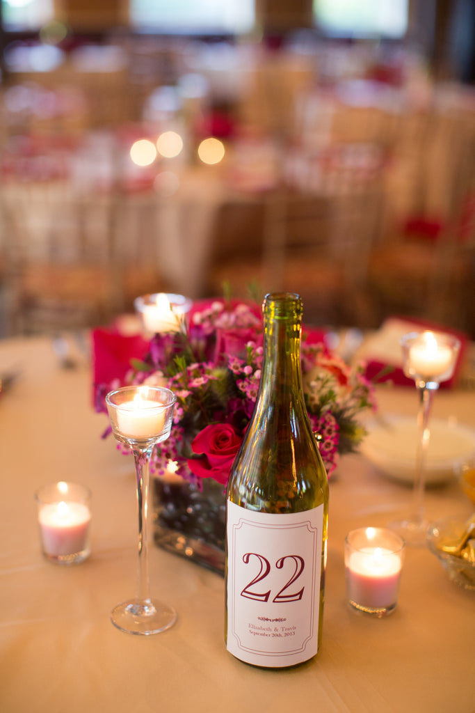 DIY wine bottle table numbers. | A Romantic Jewel-Tone Wedding