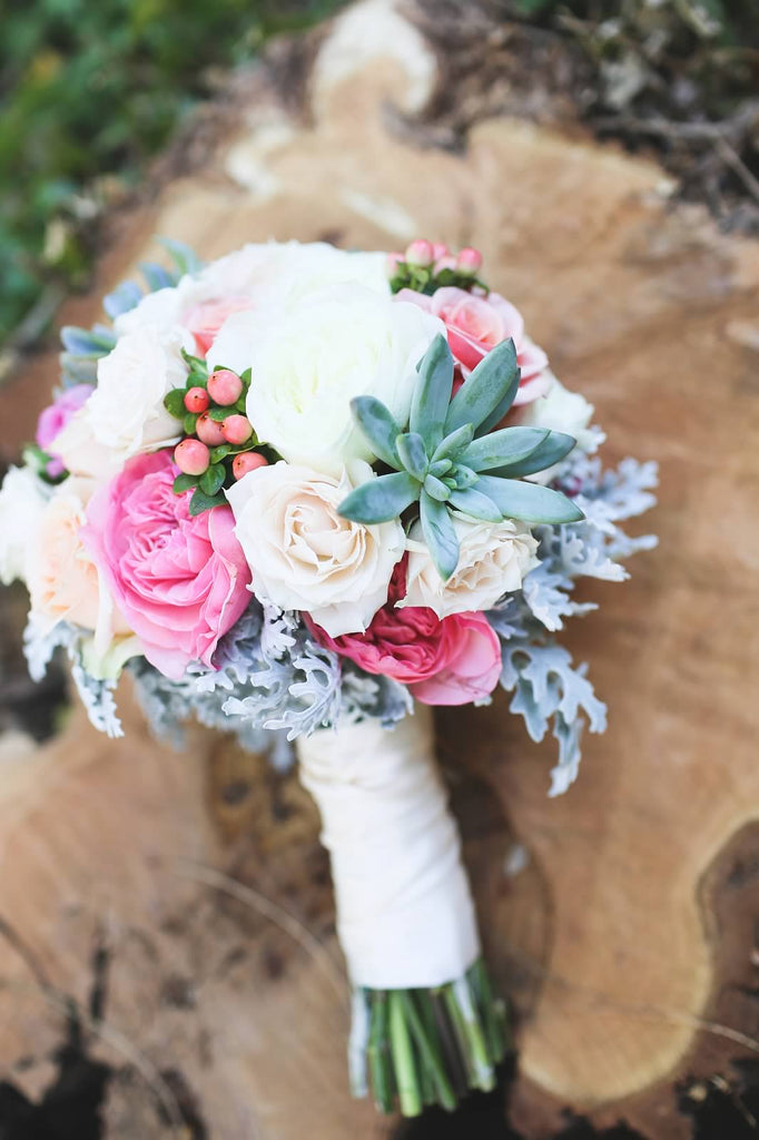 A gorgeous bridal bouquet with flowers and succulents. | A Whimsical Autumn Wedding | See the full gallery here!