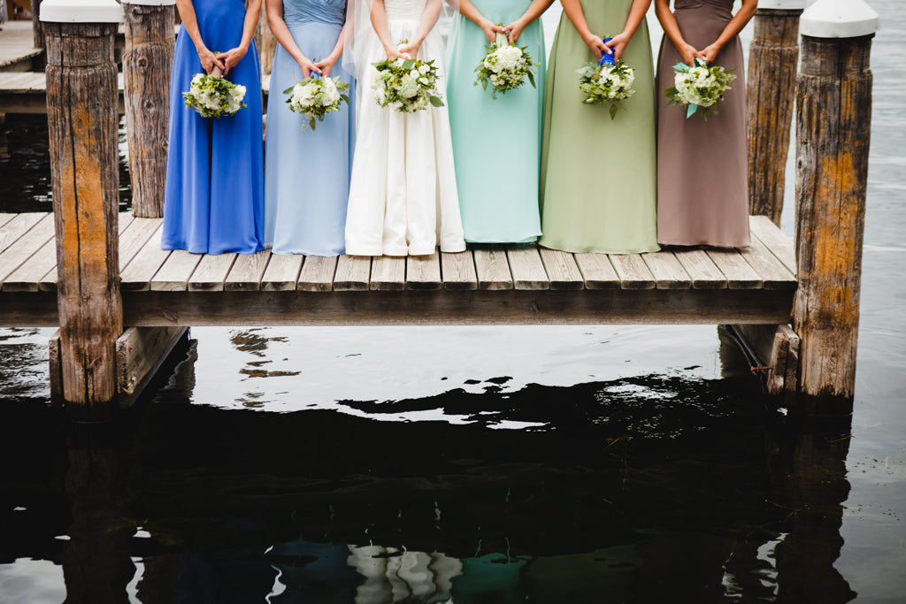 Mix and match bridesmaid dresses for a fun and unique look! | A Simple Wedding Dress for a Lakeside Ceremony
