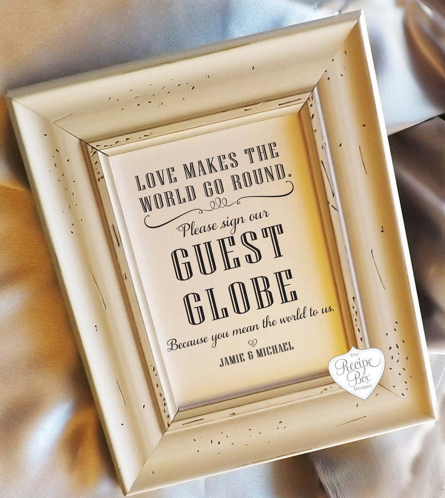 A custom sign for a guestbook globe or map | Ways to Use Maps and Globes in Your Wedding Decor