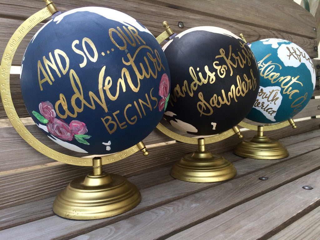 Personalizes globes for a wedding guestbook! | Ways to Use Maps and Globes in Your Wedding Decor