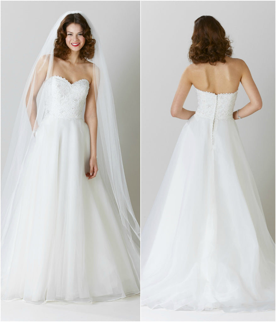 An affordable A-line bridal gown with a lace top and organza skirt. | Wedding Dresses Under $1000