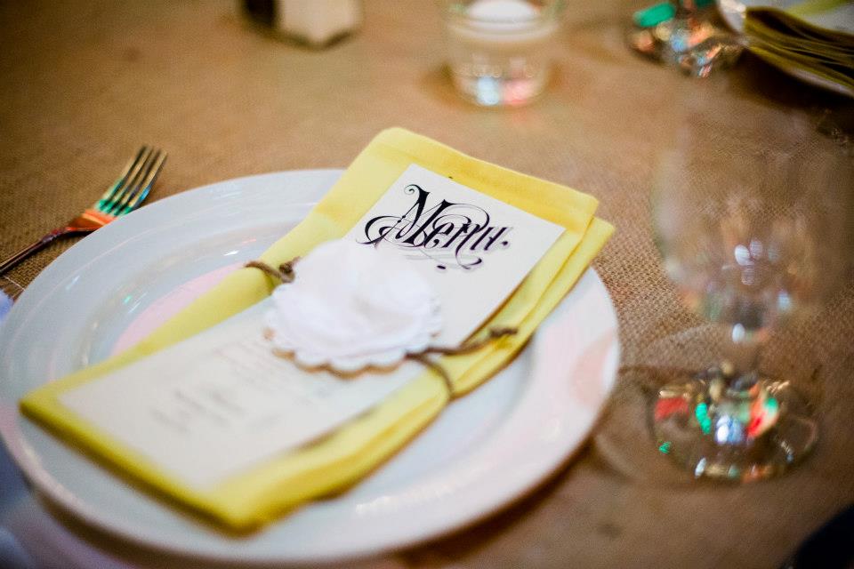 Fancy up the table linens by elegantly folding the napkins and adding a dinner menu.