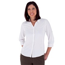 Woman wearing white button up travel shirt