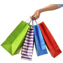 Woman holding shopping bags for shop all tech and gadgets