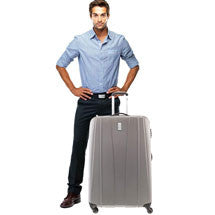 man standing with checked sized suitcase blue