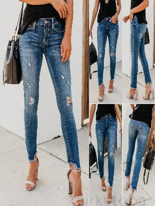 high waisted shredded jeans