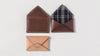 Reuben Wallet Shown In Natural, Russet, and Tobacco
