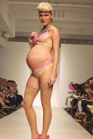 Pregnant model wearing maternity bra and panty in the runway