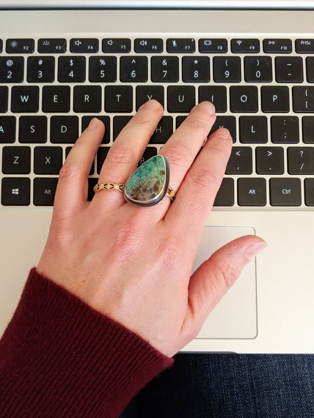 Computer keyboard with silver and gold Chrysocolla statement ring