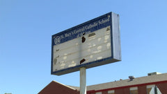 Damaged permanent lighted school marquee sign