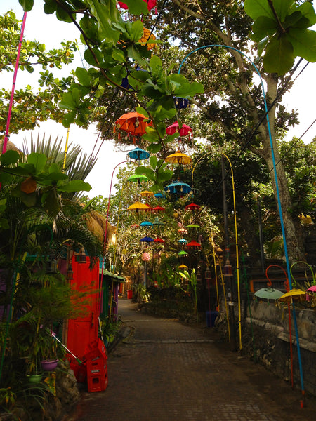 Umbrella beach walk in Legian, Bali