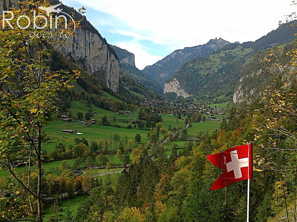 Lauterbrunnen Valley, Switzerland with Swiss flag