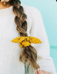 braid with yellow scrunchie
