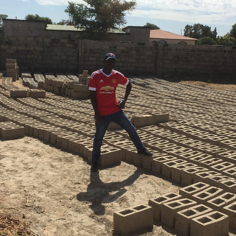 Our Gambia manager building his own compound