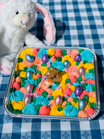 stuffed bunny next to bunny cake tray