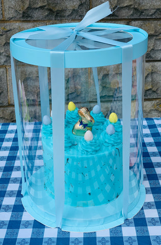 blue bunny cake in clear round tall box with ribbon