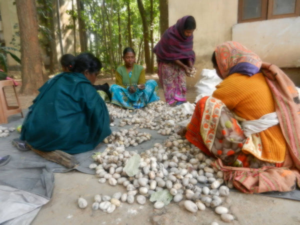 Women sorting good quality cocoon and removing stalk from the cocoon at Nagri, Jharkhand