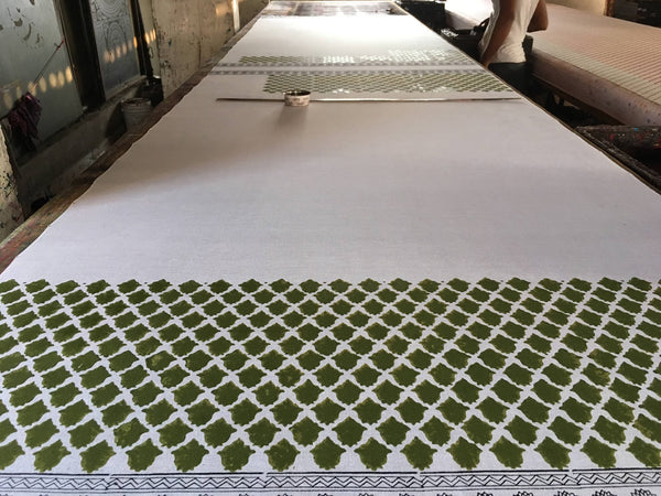 Preparing the table for hand block printing at DesiCrafts