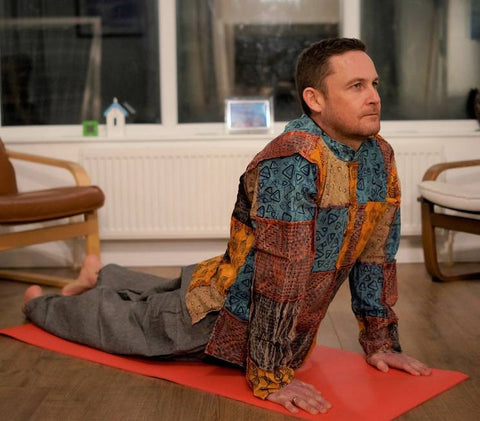 Middle age man does yoga