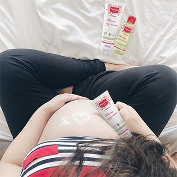 woman using Mustela products to help with dry skin during pregnancy
