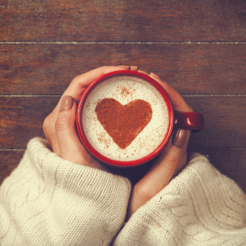 top view of cup of coffee with heart design