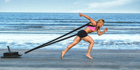Woman working out on beach