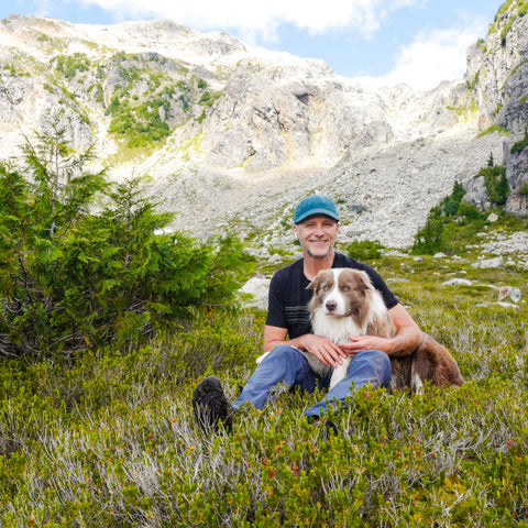 Dr. Peter Dobias hiking with his border collie Pax in the Canadian Rockies August 2020