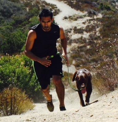 man running with dog