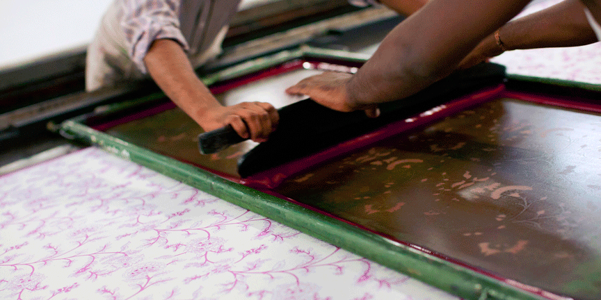 Artisans printing the natural dyes on silk fabric by silkscreen print process