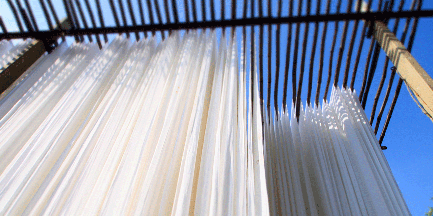 Natural silk fabric drying in sunlight after degumming process ready for printing 