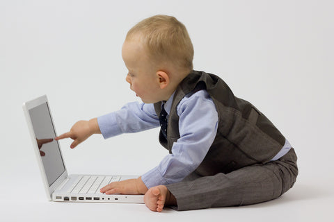 Child Sitting on Computer