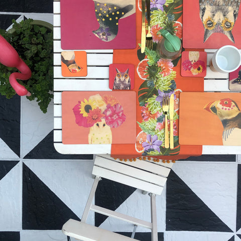 Table-Set-With-Colourful-Placemats-On-Painted-Patio