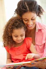 Parent reading to child, Bundle of Joy Box parenting blog, pregnancy tips
