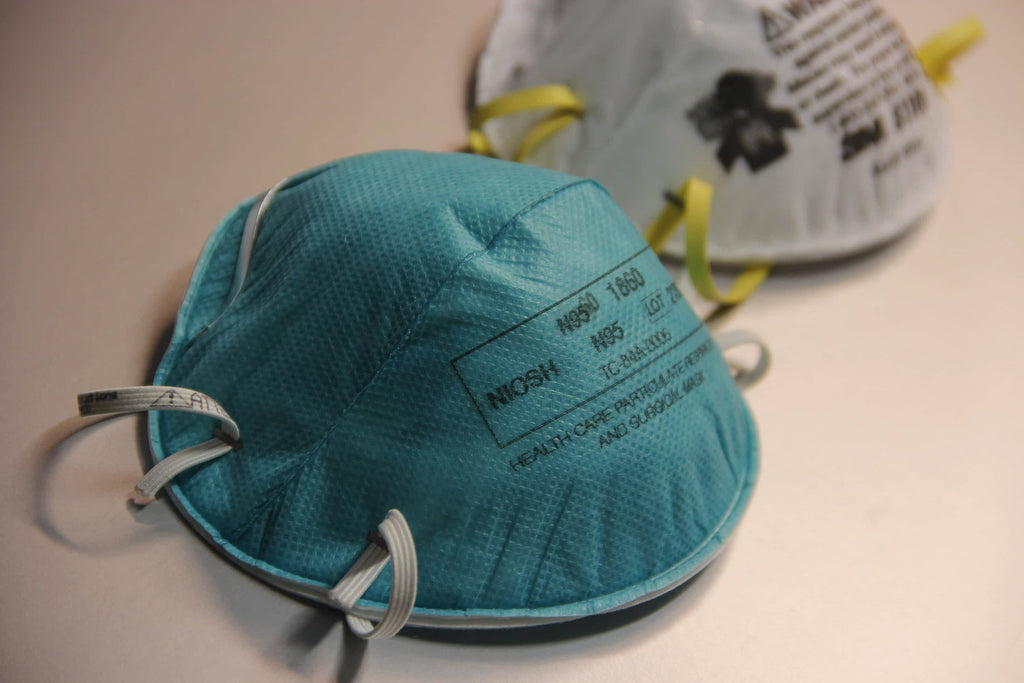 a blue and white N95 respirator mask