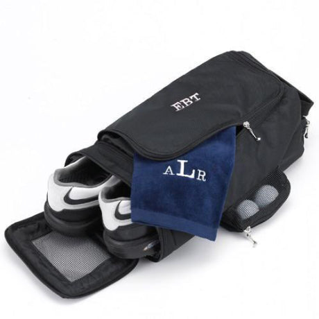 Black golf shoe bag with a dark blue towel hanging out with the initials ALR