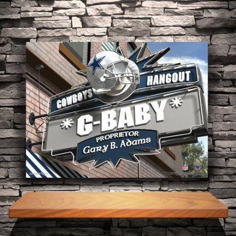 Bar sign on a canvas print that says Cowboys Hangout G-Baby Proprietor Gary B Adams