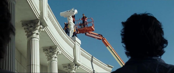 Bradley Cooper in The Hangover looking at a mattress on top of Caesars Palace 