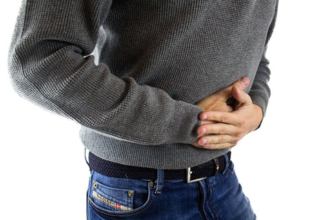 man-holding-stomach-pain