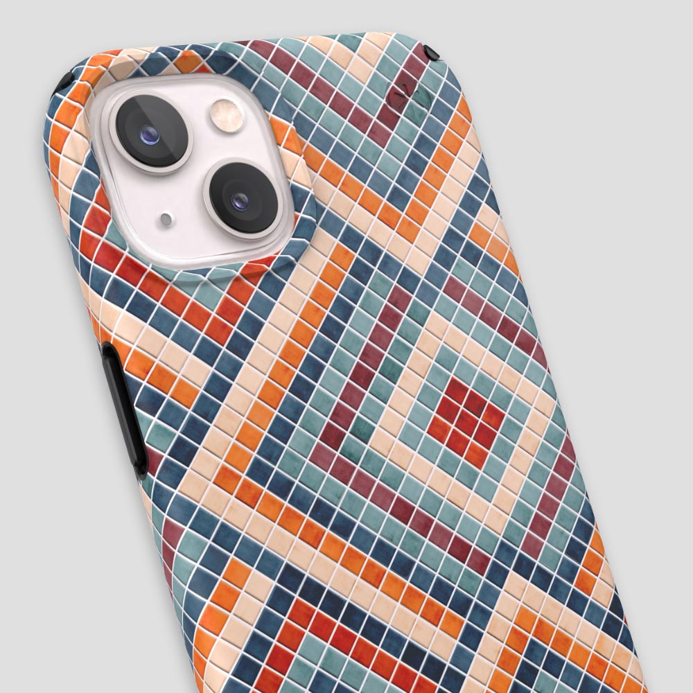 Three-quarter angle of iPhone 13 case in Tiles Are Forever pattern