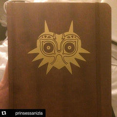 Gold Majoras Mask Vinyl Sticker Decal on moleskin