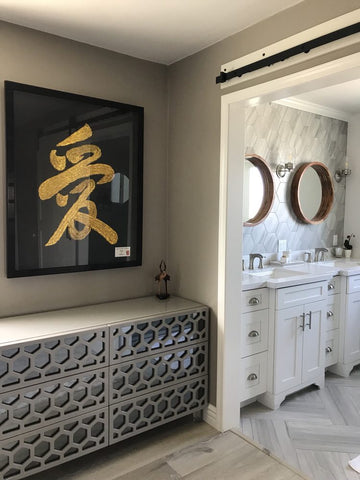 Modern-style interior with white-and-gray bathroom, geometrical design bureau in beige and gray, wall art in black and gold