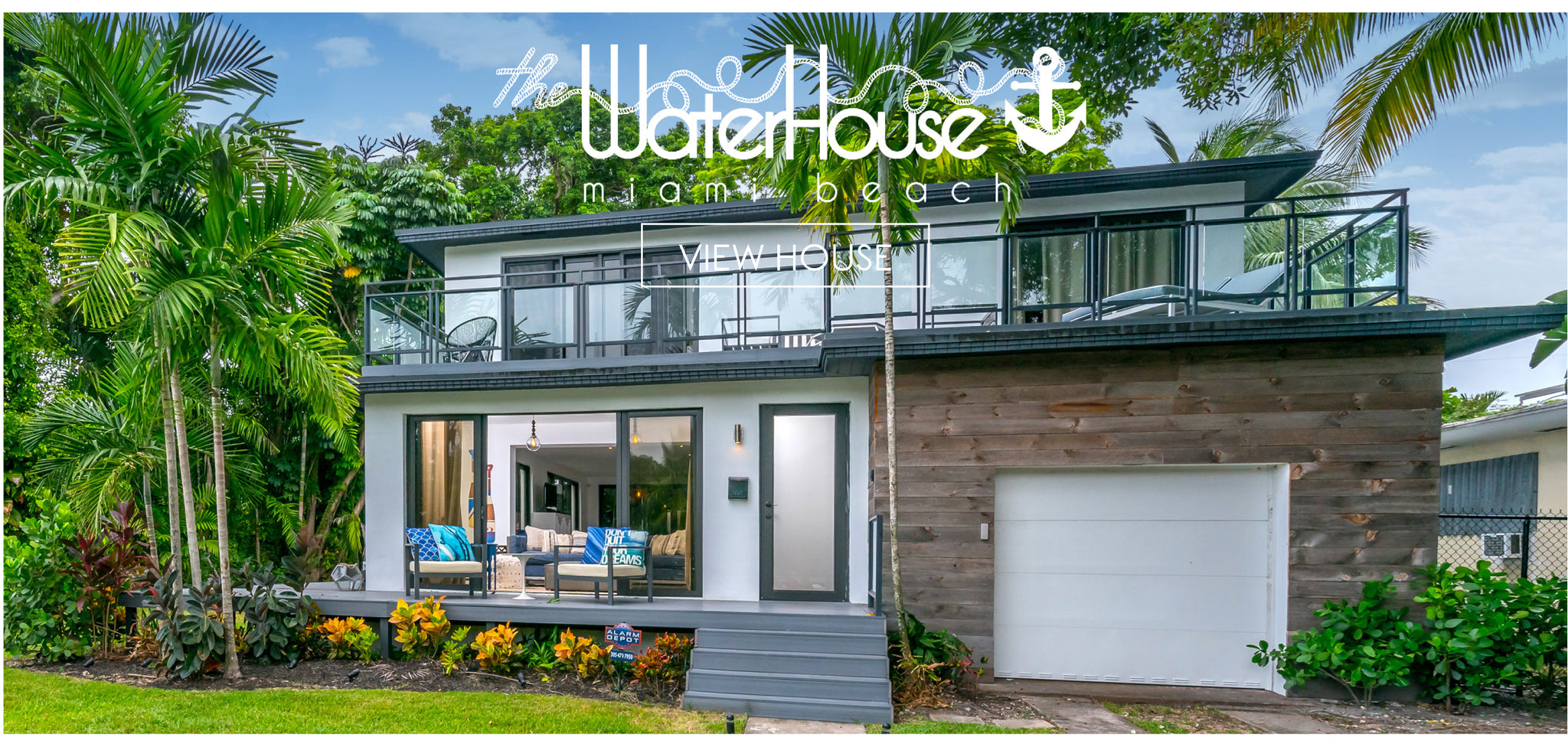 Upscale, modern two-story home with lush landscaping, 'The Water House Miami Beach' and 'View House' in white print overlay