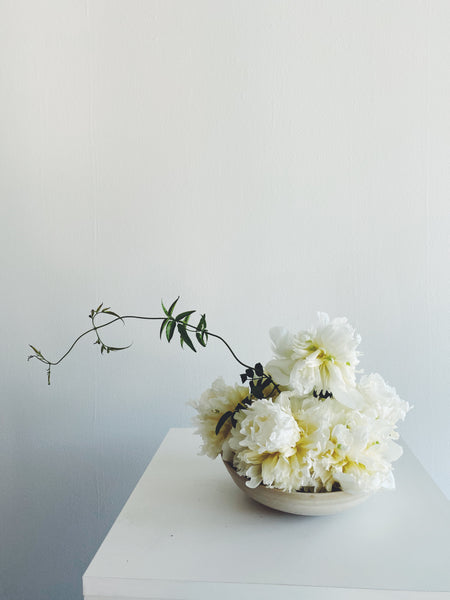 White flowers with foilage on table
