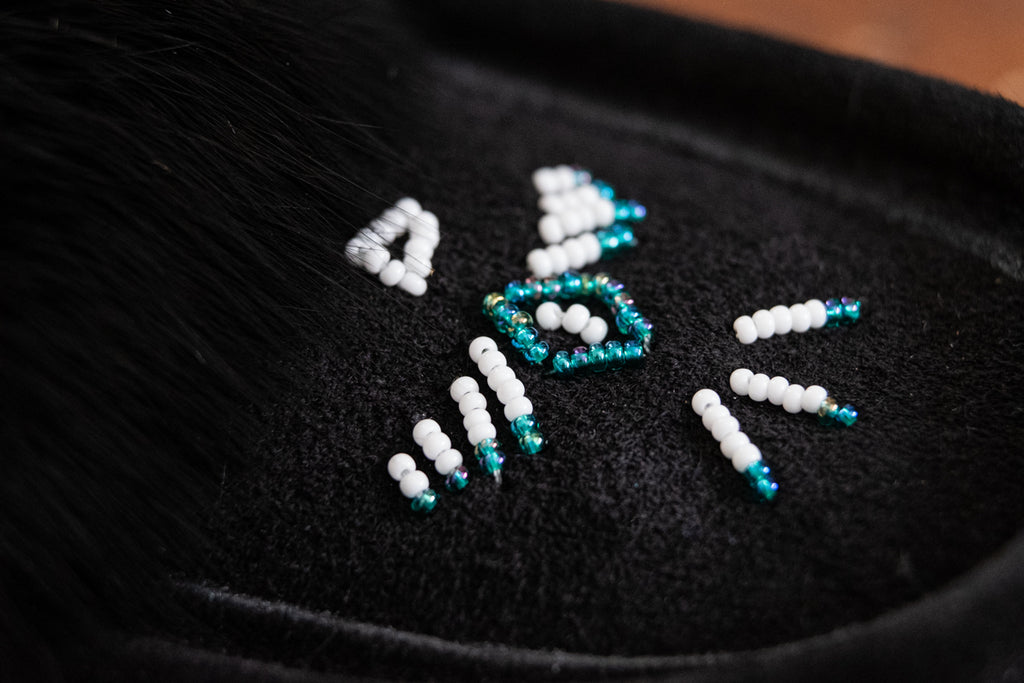 close-up of hand-beading on authentic moccasins