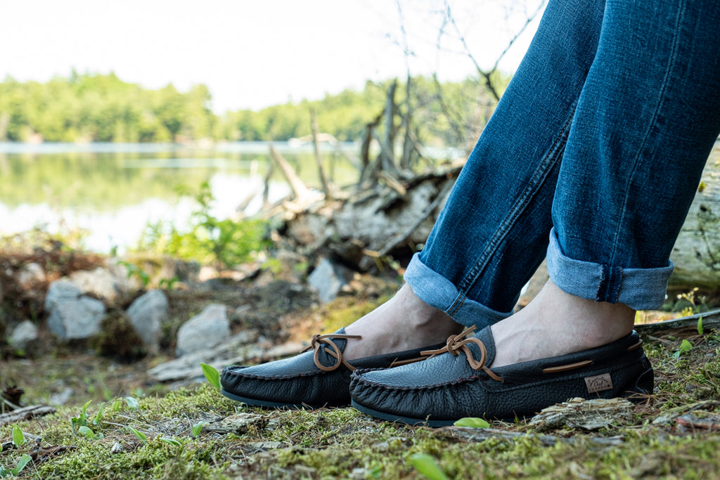 beautiful dark brown leather moccasins scenic background