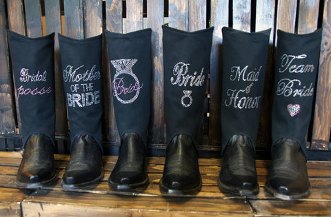 Six Black cowboy boots with black boot covers