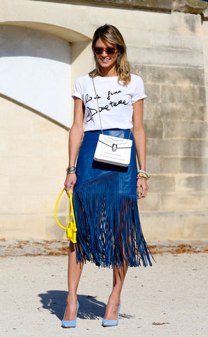 woman wearing blue fringed skirt